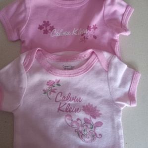2 Calvin Klein bodysuits one I gently used the other one is new but without tags